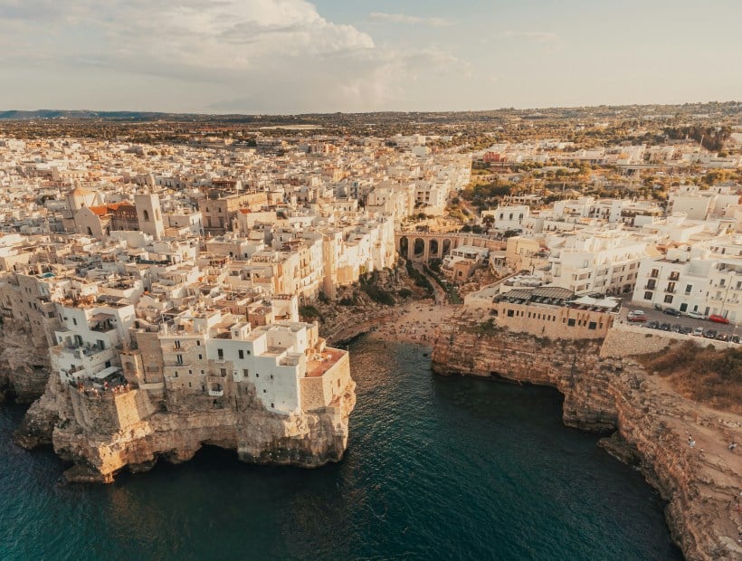 Polignano a Mare clifftop view over turquoise sea in Puglia Italy Trails