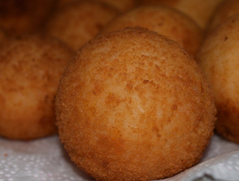 Traditional Sicilian arancini street food at Palermo market