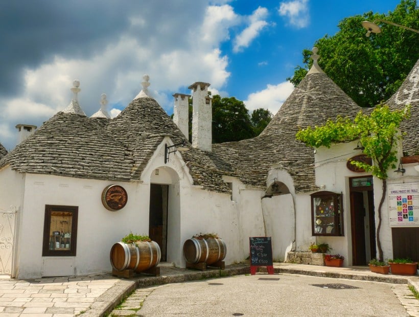 Traditional trulli stone houses in Alberobello Puglia at sunset Italy Trails