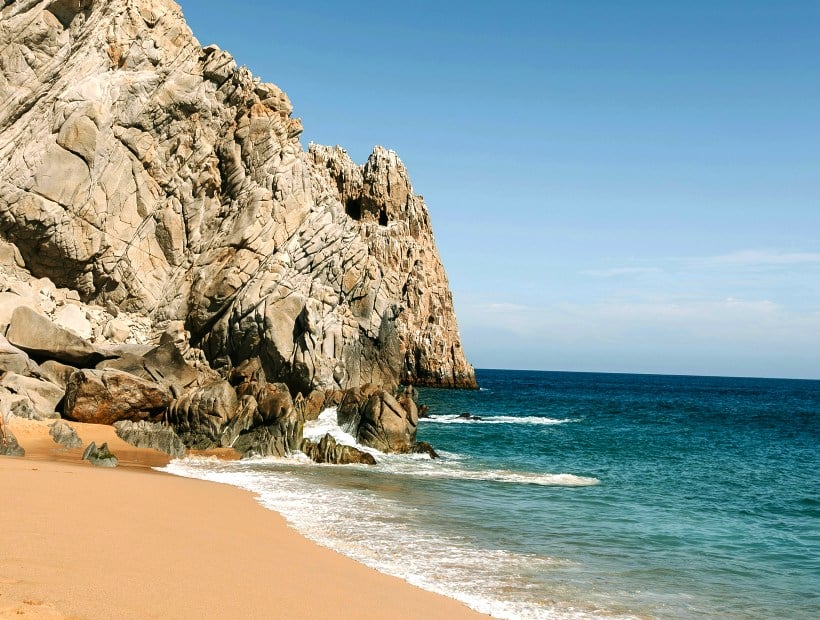 beach dramatic cliffs and emerald sea Sardinia Italy Trails